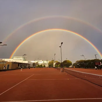 Double rainbow over the clay tennis courts